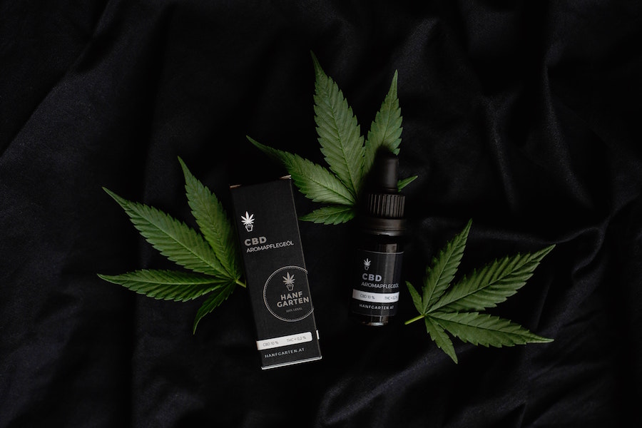 CBD oil and cannabis leaves