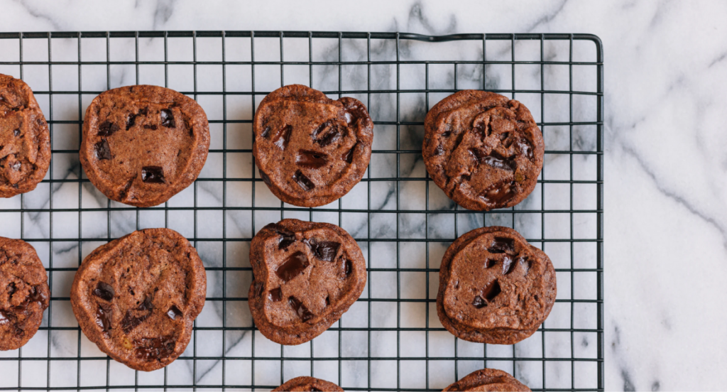 freshly baked cbd infused chocolate chunk cookies cool on a cooling rack