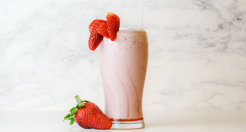 pink strawberry smoothies with strawberry garnish