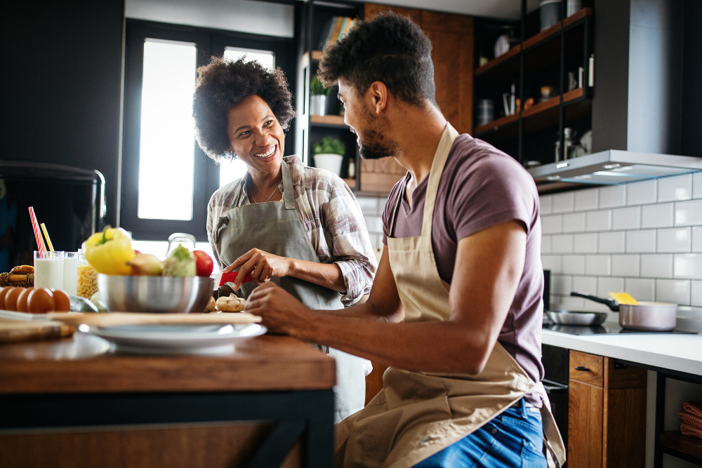 couple prepares food in their kitchen