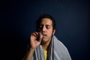 man smoking a joint