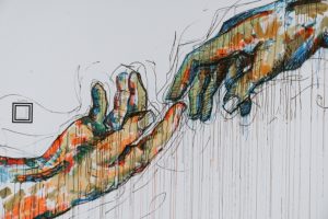 Mural of hands reaching for each other